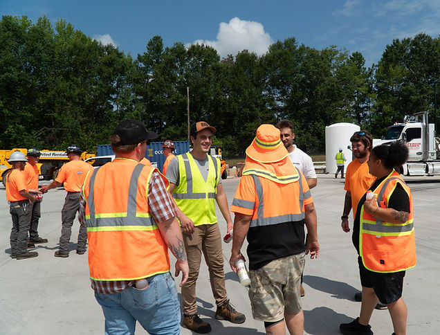 Team of logistics professionals in safety vests