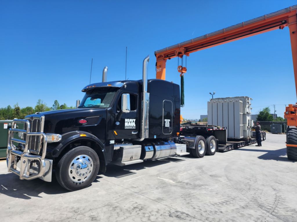 Turnkey heavy haul move with rigging support for loading an industrial equipment module.
