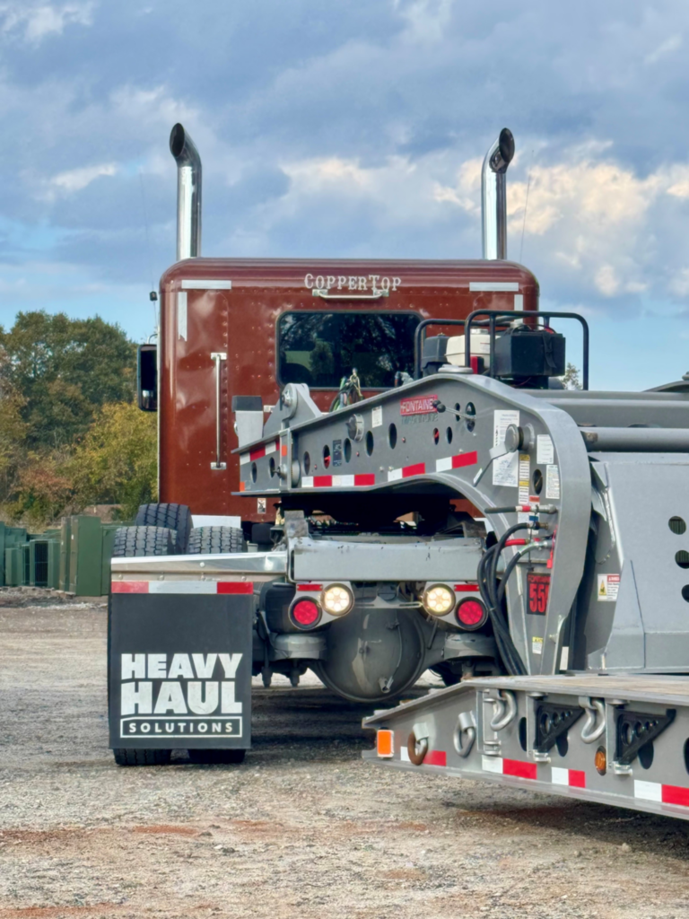 Heavy haul trailer gooseneck and equipment setup for specialized oversize load transport.